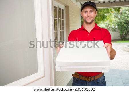 Pizza delivery man delivering pizzas to a house