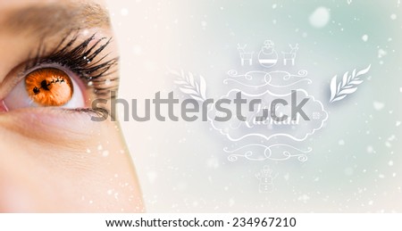 Orange eye looking up on female face against purple vignette