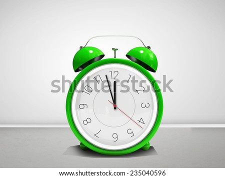 Alarm clock counting down to twelve against grey room