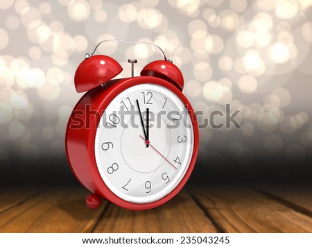 Alarm clock counting down to twelve against shimmering light design over boards