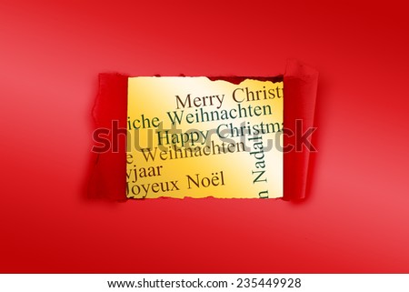 Rip in paper against holiday greetings in different languages