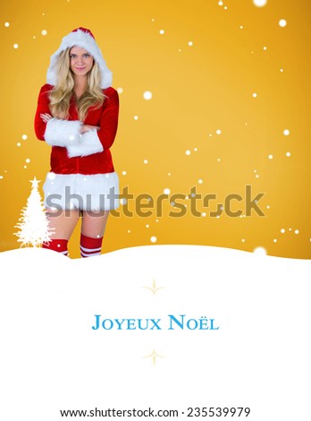 pretty girl in santa outfit with arms crossed against border