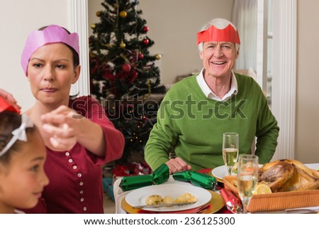 Family in party at christmas dinner at home in the living room
