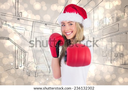 Festive blonde punching with boxing gloves against light glowing dots design pattern