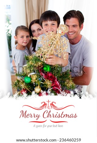 Happy family decorating a Christmas tree against border