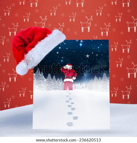 Santa delivery presents to village against red reindeer pattern