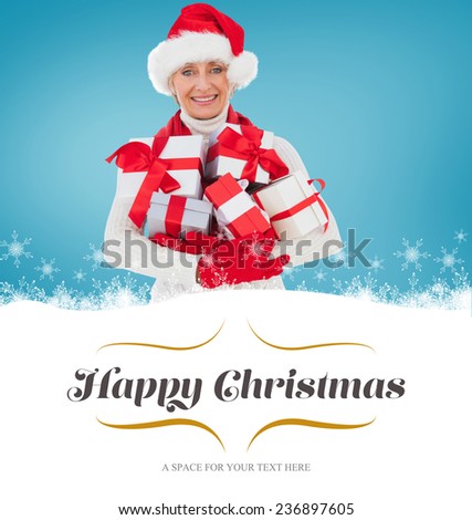 festive woman holding gifts against border