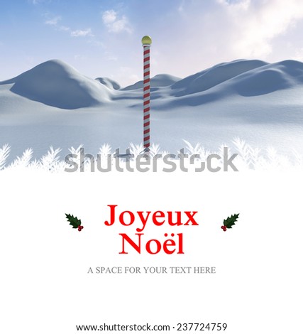 Joyeux noel against snowy land scape with pole