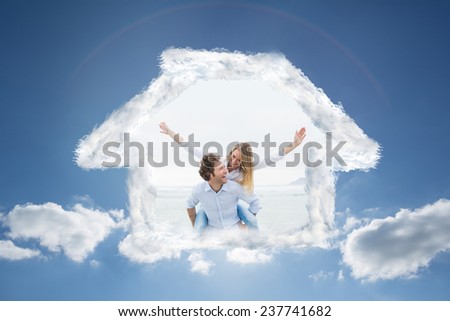 Man piggybacking woman at beach against cloudy sky with sunshine