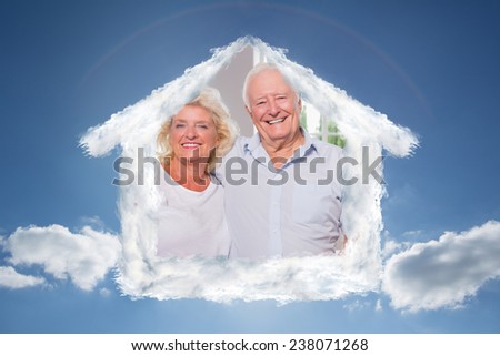 Grandparents in front of their family against cloudy sky with sunshine