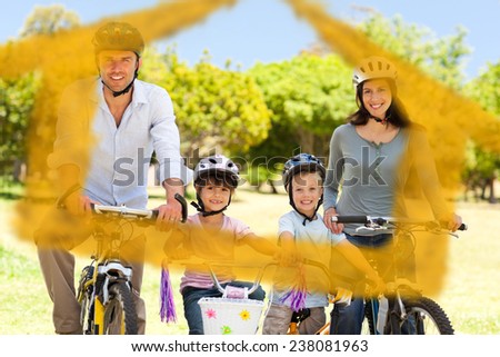Family with their bikes against house outline in clouds