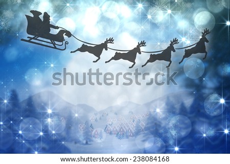 Silhouette of santa claus and reindeer against cute christmas village under huge full moon