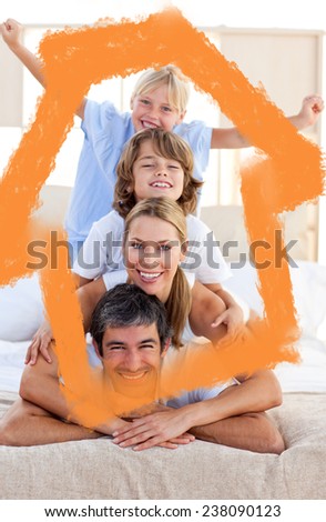 Loving family having fun against house outline in clouds