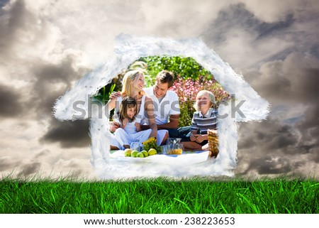 House outline in clouds against green grass under grey sky