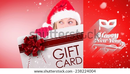 Composite image of festive blonde holding a poster against red vignette