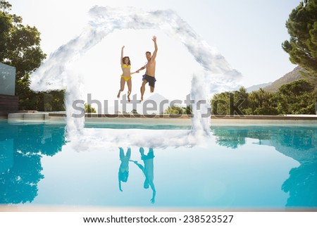 Cheerful couple jumping into swimming pool against house outline in clouds