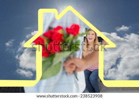 Man hiding bouquet of roses from smiling girlfriend on the couch against blue sky with clouds and sun