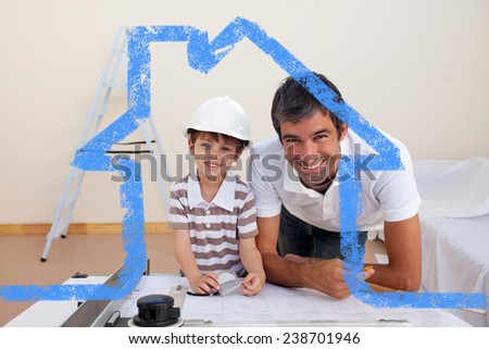 Smiling dad and little boy studying architecture against house outline