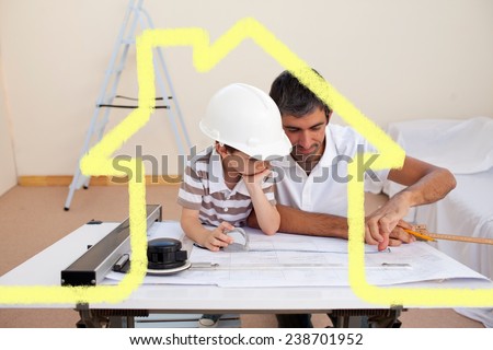 Father and son studying working with plans against house outline