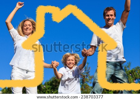 Beautiful family playing in the garden against house outline