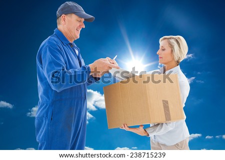 Happy delivery man with customer against cloudy sky with sunshine