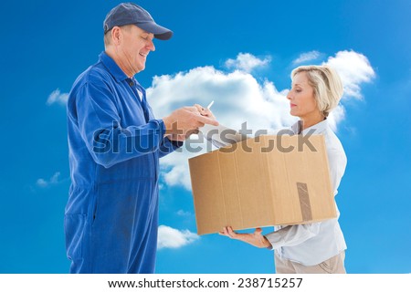 Happy delivery man with customer against cloudy sky