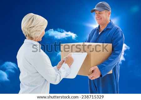 Happy delivery man with customer against bright blue sky with clouds