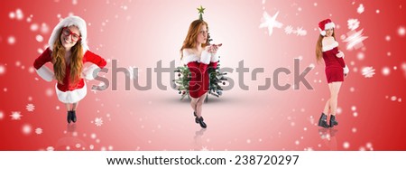Festive redhead blowing over hands against white light dots on red