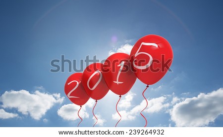 2015 balloons against cloudy sky with sunshine