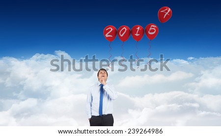 Thinking businessman touching his chin against bright blue sky over clouds