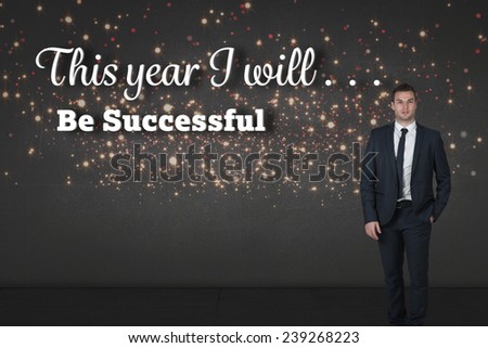 Businessman standing with hand in pocket against red and gold glittering light