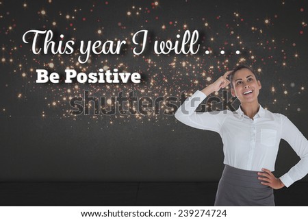 Smiling thoughtful businesswoman against red and gold glittering light