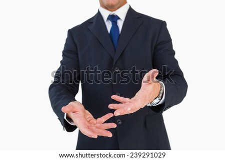 Mid section of a businessman with arms out on white background