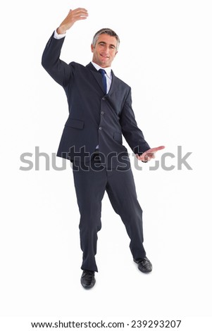 Happy businessman well dressed with arms out on white background