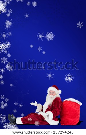 Santa sits leaned on his bag and has no clue against blue
