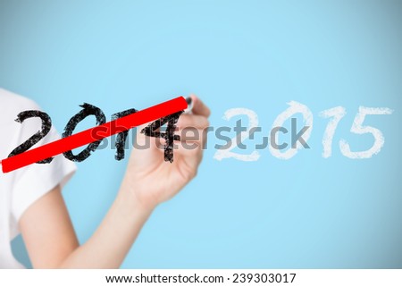 Female hand holding black whiteboard marker against blue background with vignette