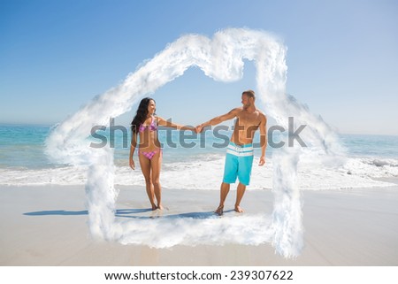 Handsome man holding his girlfriends hand against house outline in clouds