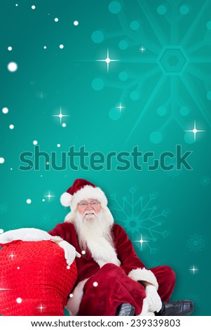 Santa sits next to his bag against green snowflake background