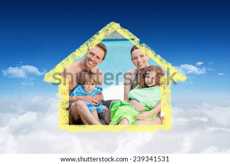 Portrait of a happy family beside the swimming pool against bright blue sky over clouds