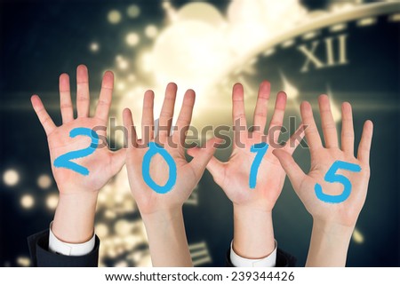 Business peoples hands against black and gold new year graphic