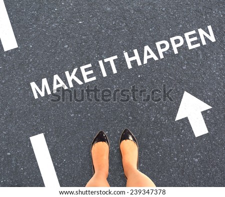 Businesswomans feet against road