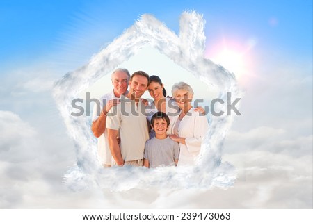 Portrait of a smiling family at the beach against blue sky with white clouds