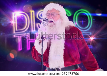 Santa Claus is singing Christmas songs against digitally generated colourful discotheque text