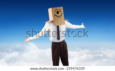 Anonymous businessman with arms out against blue sky over clouds