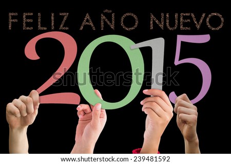 Hands holding poster against glittering feliz ano nuevo