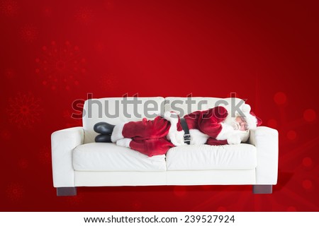 Father Christmas sleeps on a couch against red background