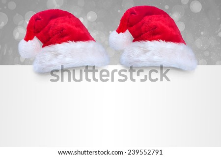 Santa hat on poster against grey abstract light spot design