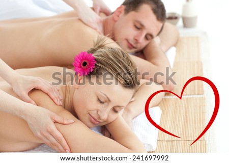 Relaxing couple having a massage against heart