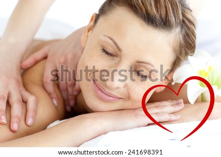 Young woman enjoying a back massage against heart