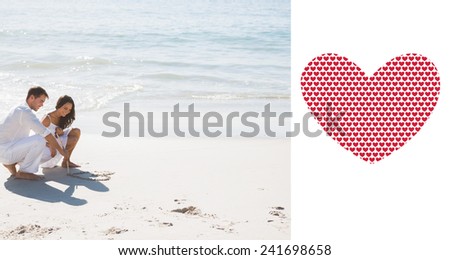 Cute couple drawing a heart in the sand against valentines day pattern